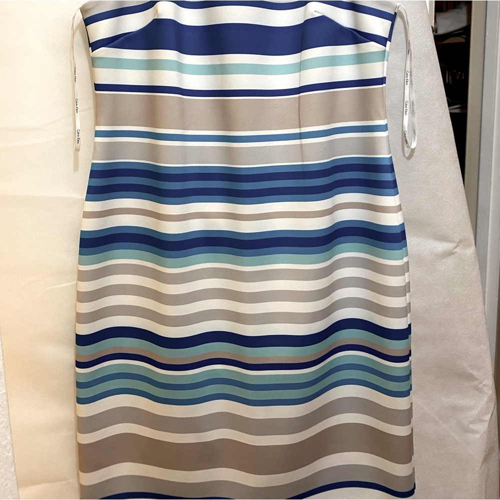 Beautiful striped must have sleeveless summer dress.